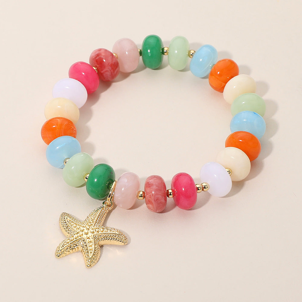 Madeline Love Gold, Multi Textured Metal Starfish Charm Accent Resin Pebble Beaded Stretch Bracelet - Bracelets
