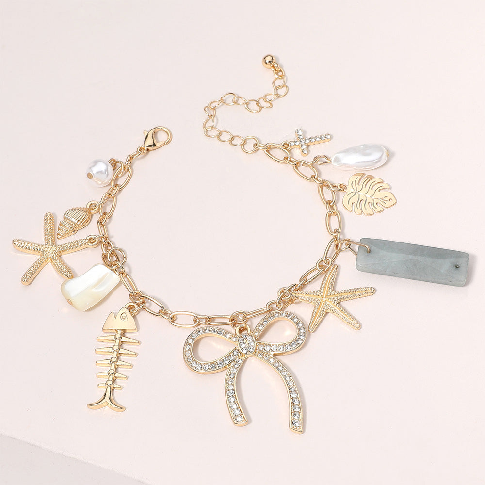 Clear, Gold Stone Paved Bow Metal Starfish Fish Shell Pearl Tropical Leaf Charm Station Bracelet