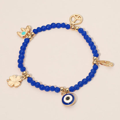 Madeline Love Blue, Gold Evil Eye Clover Peace Elephant Hamsa Hand Charm Beaded Stretch Bracelet - Bracelets