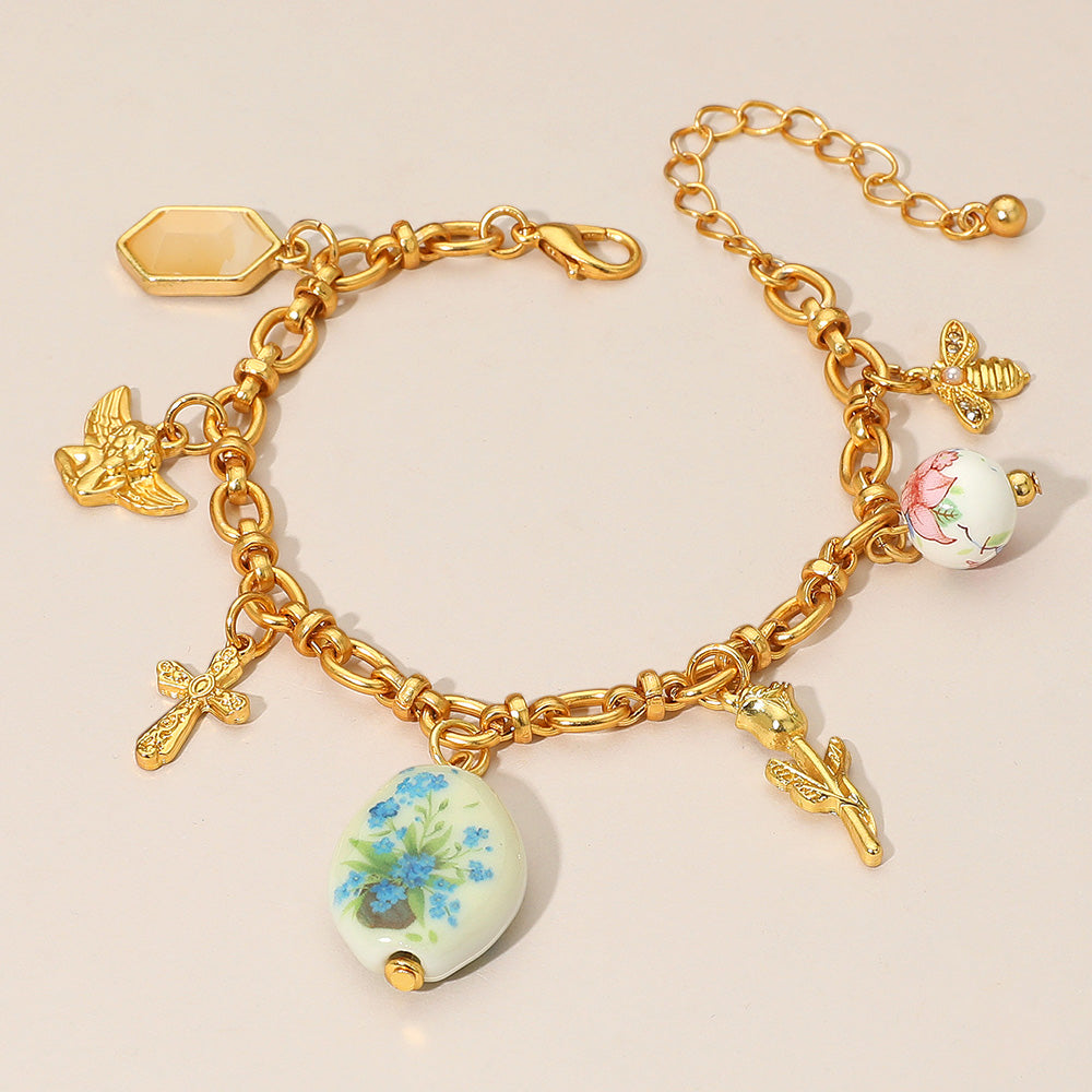 Madeline Love Green, Matte gold Vintage Floral Ceramic Charm Metal Angel Flower Stem Honey Bee Charm Station Bracelet - Bracelets