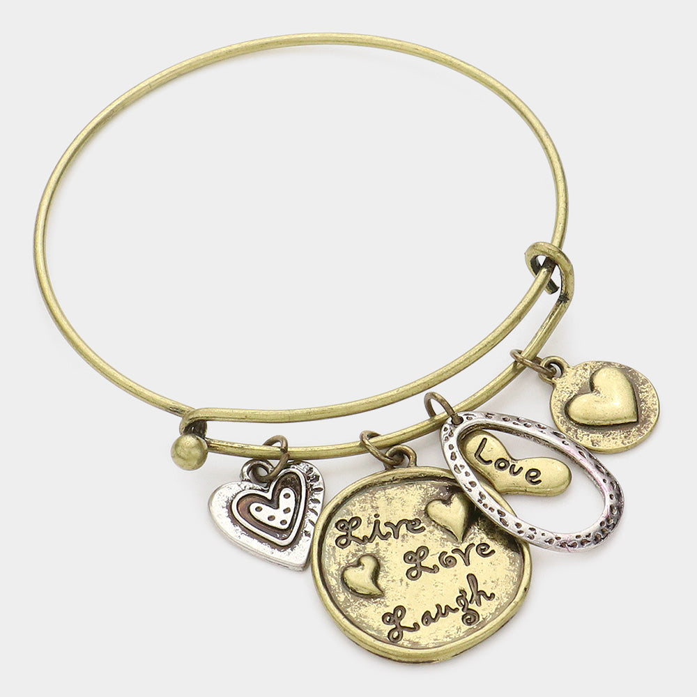 Live Love Laugh Message Heart Charm Bracelet serves as a daily reminder to live life to the fullest, love with all your heart, and find joy in every moment. Crafted with a heart-shaped charm and inspirational message, this bracelet is a beautiful accessory and a meaningful symbol. 