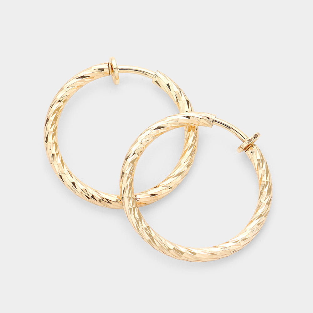 Madeline Love Gold 1.25" Textured metal hoop clip on earrings
