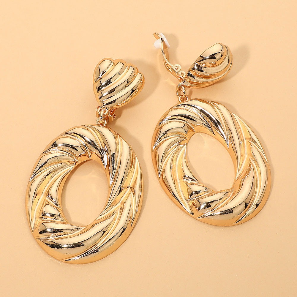 Madeline Love Gold Bold Sculptural Swirl Hop Drop Statement Clip On Earrings