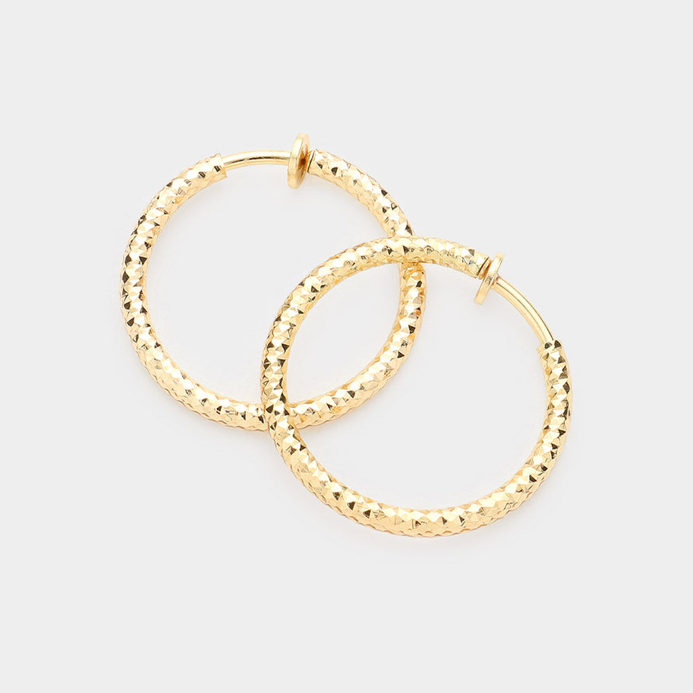 Madeline Love Gold 1.25" Textured Metal Hoop Clip on Earrings