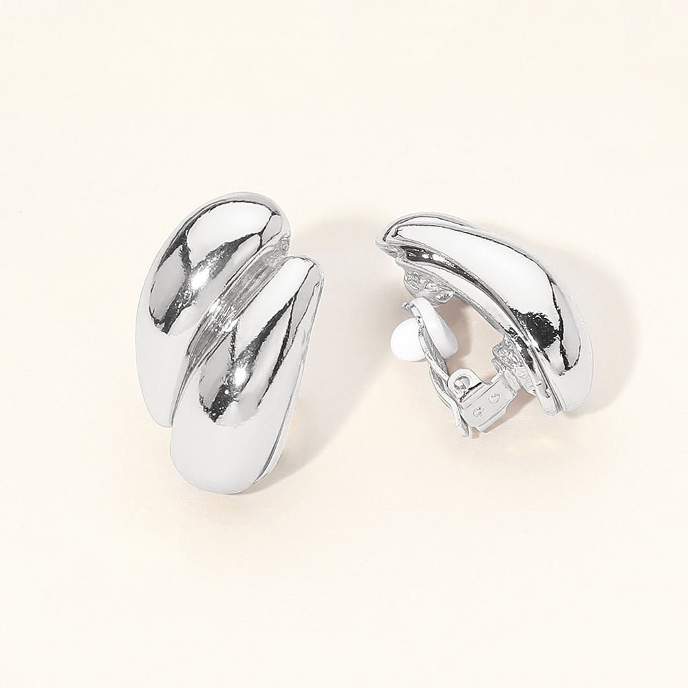 Madeline Love Silver Sculpted Curved Metal Clip On Earrings