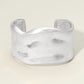 Madeline Love Worn Silver Wide Hammered Metal Cuff Bracelet - Bracelets