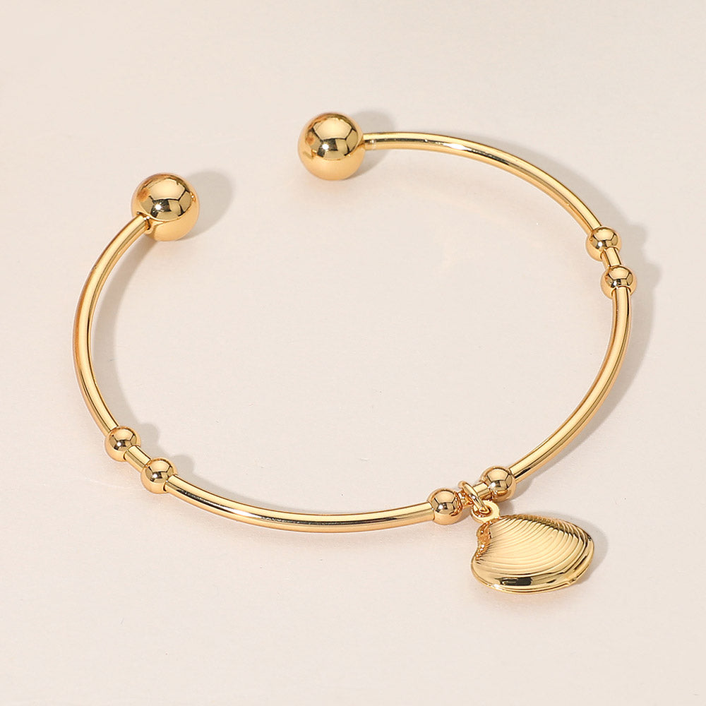 Madeline Love Gold Stainless Steel Seashell Charm Cuff Bracelet