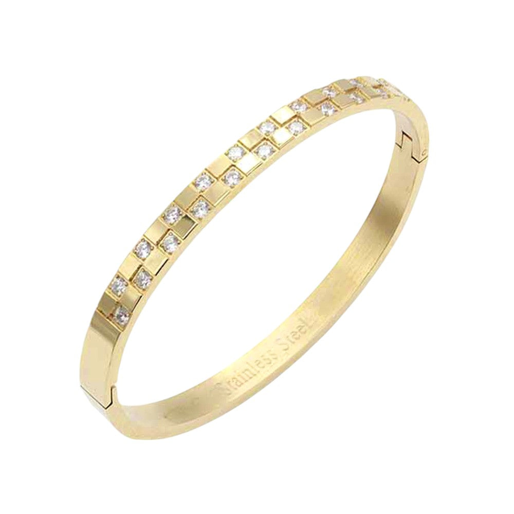 Gold CZ Embellished Stainless Steel Bangle Evening Bracelet is the perfect accessory for a glamorous evening out. Made with high-quality materials, it offers both style and durability. Its classic design and sparkling CZ stones will elevate any outfit, making you stand out with elegance.