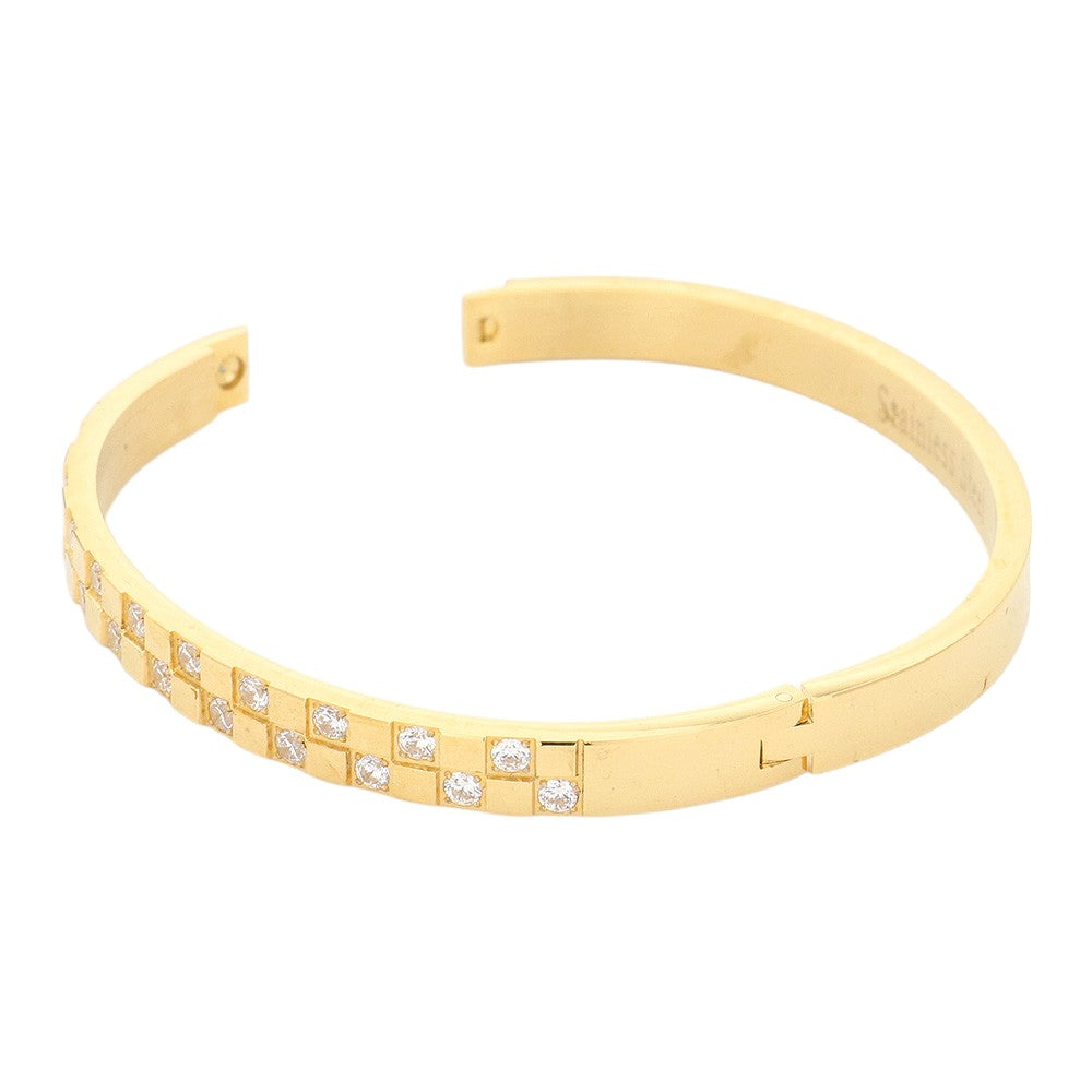 Gold CZ Embellished Stainless Steel Bangle Evening Bracelet is the perfect accessory for a glamorous evening out. Made with high-quality materials, it offers both style and durability. Its classic design and sparkling CZ stones will elevate any outfit, making you stand out with elegance.