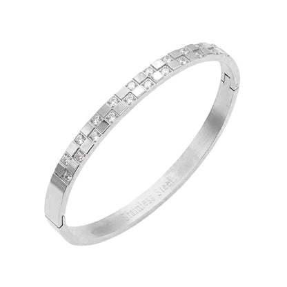 Silver CZ Embellished Stainless Steel Bangle Evening Bracelet is the perfect accessory for a glamorous evening out. Made with high-quality materials, it offers both style and durability. Its classic design and sparkling CZ stones will elevate any outfit, making you stand out with elegance.