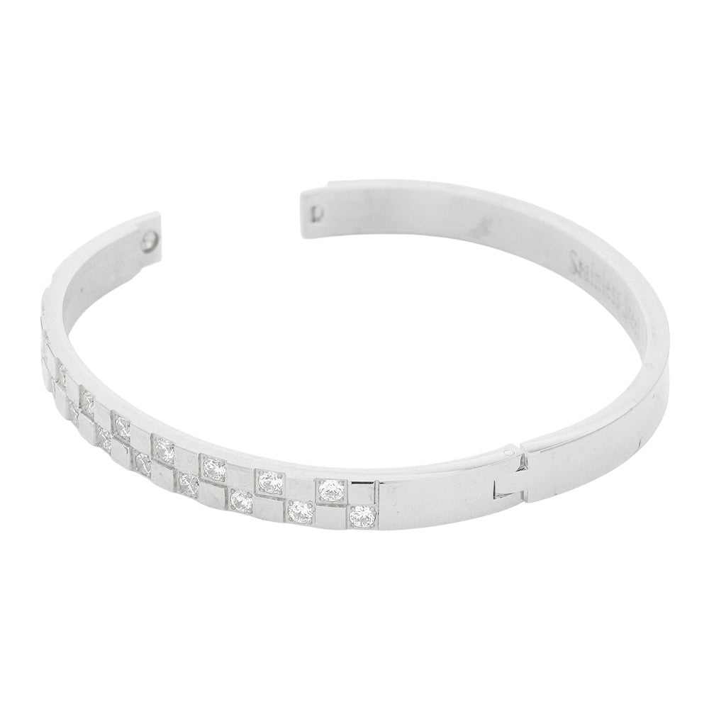 Silver CZ Embellished Stainless Steel Bangle Evening Bracelet is the perfect accessory for a glamorous evening out. Made with high-quality materials, it offers both style and durability. Its classic design and sparkling CZ stones will elevate any outfit, making you stand out with elegance.