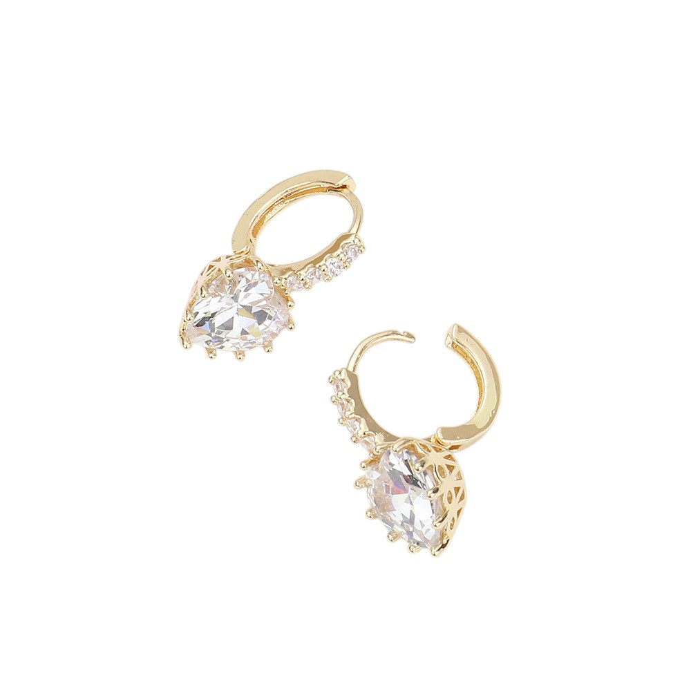 CZ Heart Evening Huggie Earrings. Made with stunning CZ stones, these elegant earrings are perfect for any evening occasion. The huggie design ensures a secure and comfortable fit, while the heart shape adds a touch of romance. Upgrade your jewelry collection with these must-have earrings.