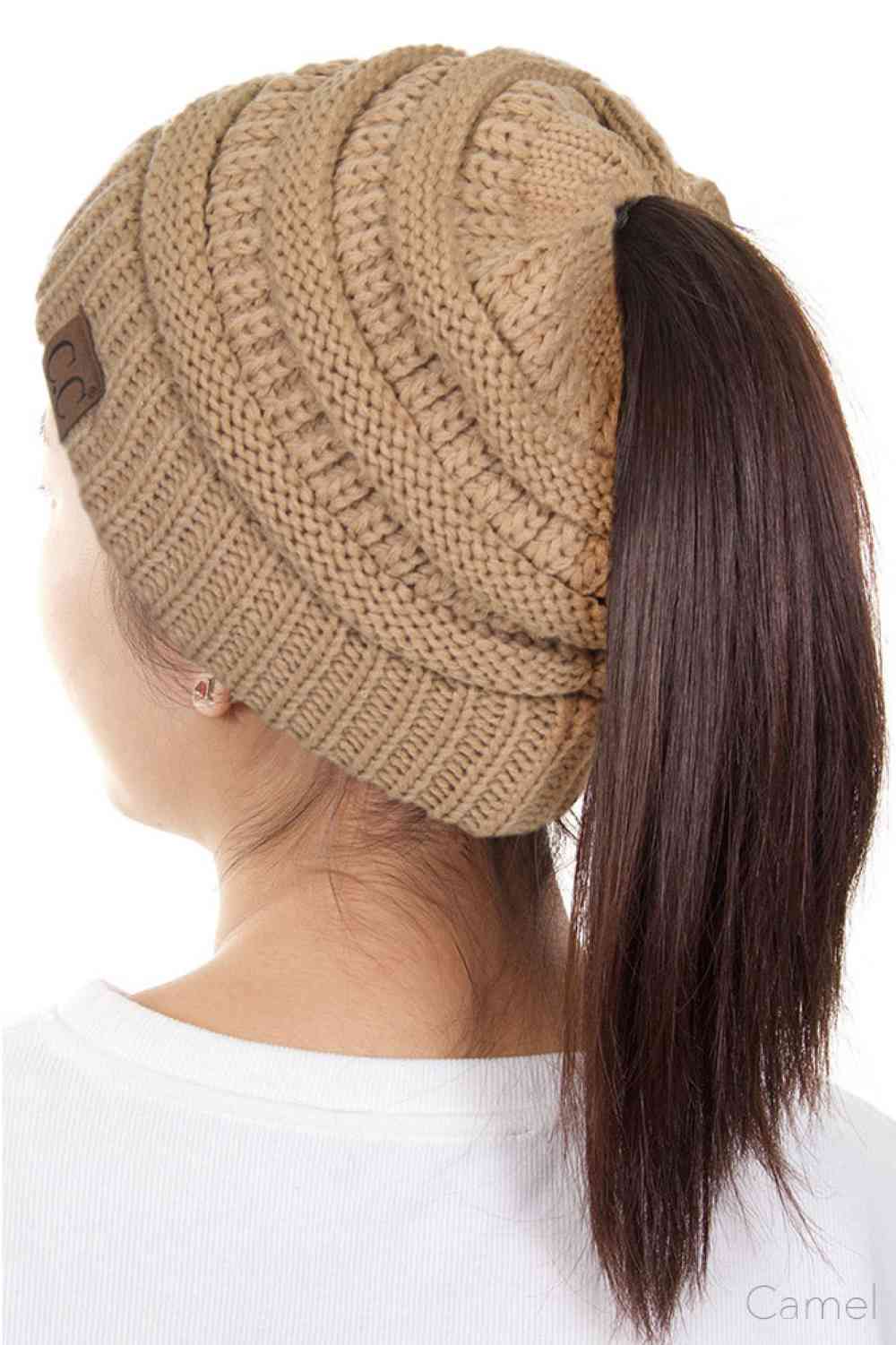 Camel The C.C Solid Color Ponytail Messy Bun Beanie combines comfort with versatility for effortless everyday style. Crafted from 100% soft acrylic, this beanie features an open crown design that accommodates ponytails and messy buns while keeping you warm. The one-size-fits-most construction ensures a secure, flattering fit for virtually anyone. Perfect for casual outings, workouts, or relaxed weekends, this practical accessory transitions seamlessly from season to season.