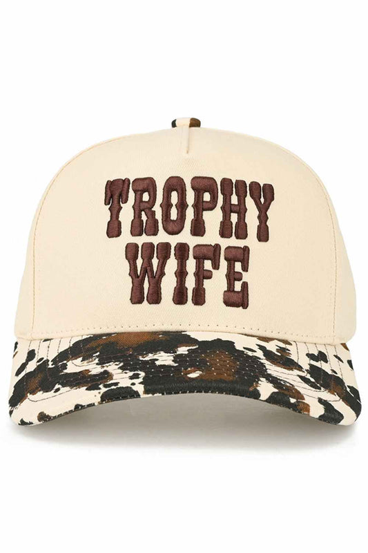 Camo Elevate your casual style with this playful C.C TROPHY WIFE trucker hat, featuring bold embroidered lettering and eye-catching cow print design. Crafted from 100% cotton for breathability and comfort, this one-size-fits-all cap features an adjustable fit with a 22.5" circumference. Perfect for making a statement while keeping the sun at bay. Made in Vietnam with quality construction that lasts.