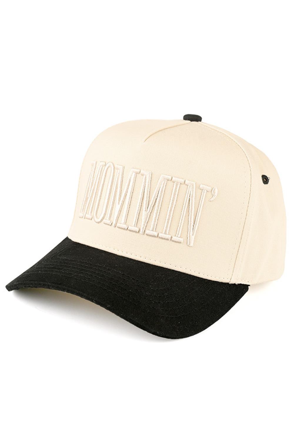 Black Celebrate mom life in style with the C.C MOMMIN two-tone trucker hat, featuring clean letter embroidery for a bold yet laid-back look. With its classic baseball cap silhouette and breathable mesh back, this hat offers all-day comfort and an effortlessly cool finish for busy, on-the-go days.