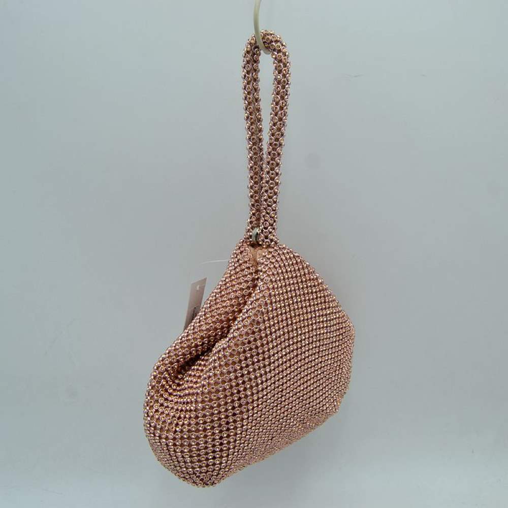Champ Make a bold yet elegant statement with the shimmering evening pouch. Perfect for nights out, formal dinners, or special events, this unique wristlet infuses any outfit with instant texture and subtle sparkle.