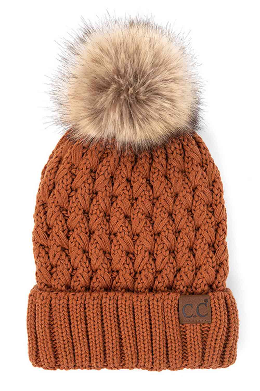 Clay Elevate your winter wardrobe with the C.C Lattice Crossover Stitch Beanie, featuring an intricate lattice pattern and cozy pom detail. Crafted from 100% soft acrylic, this beanie delivers warmth and comfort without the weight. The crossover stitch design adds visual interest while the relaxed fit suits most face shapes. Perfect for layering over your favorite winter looks, this versatile beanie transitions effortlessly from casual outings to outdoor adventures. One size fits most for easy, everyday wea