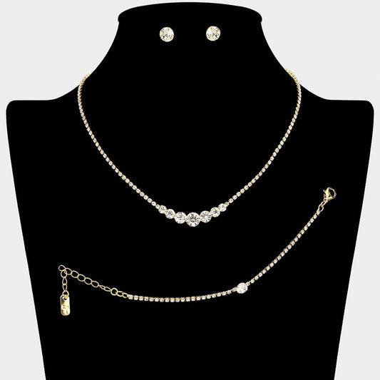 Clear Gold Timeless matching necklace, stud earring, and bracelet set designed with a clean round stone centerpiece for effortless elegance. Ideal for weddings, formal events, parties, and everyday special occasion styling. A versatile set that delivers refined sparkle and coordinated sophistication.