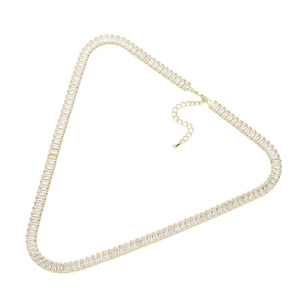 Clear Gold Stainless Steel Emerald Cut CZ Stone Tennis Chain Necklace exudes elegance and sophistication. Made with durable stainless steel and featuring sparkling emerald cut CZ stones, it's the perfect accessory to elevate any outfit. With its classic tennis chain design and stunning stones, this necklace is a must-have for any jewelry collection.