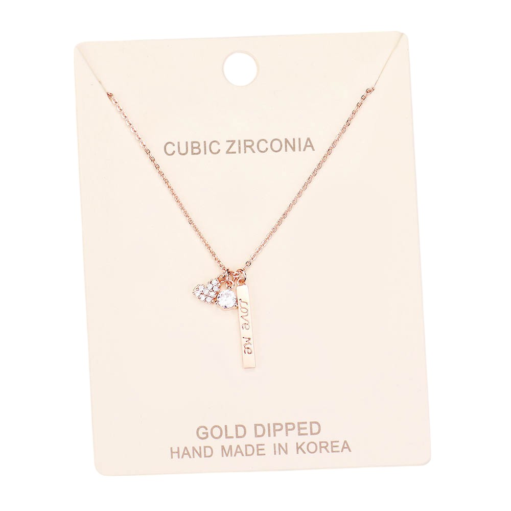 Clear Rose Gold Dipped CZ 'Love Me' Heart Pendant Necklace is the perfect accessory to show your love. The pendant is expertly crafted with cubic zirconia stones and dipped in gold for a stunning and durable shine. A beautiful and meaningful gift for any special occasion.