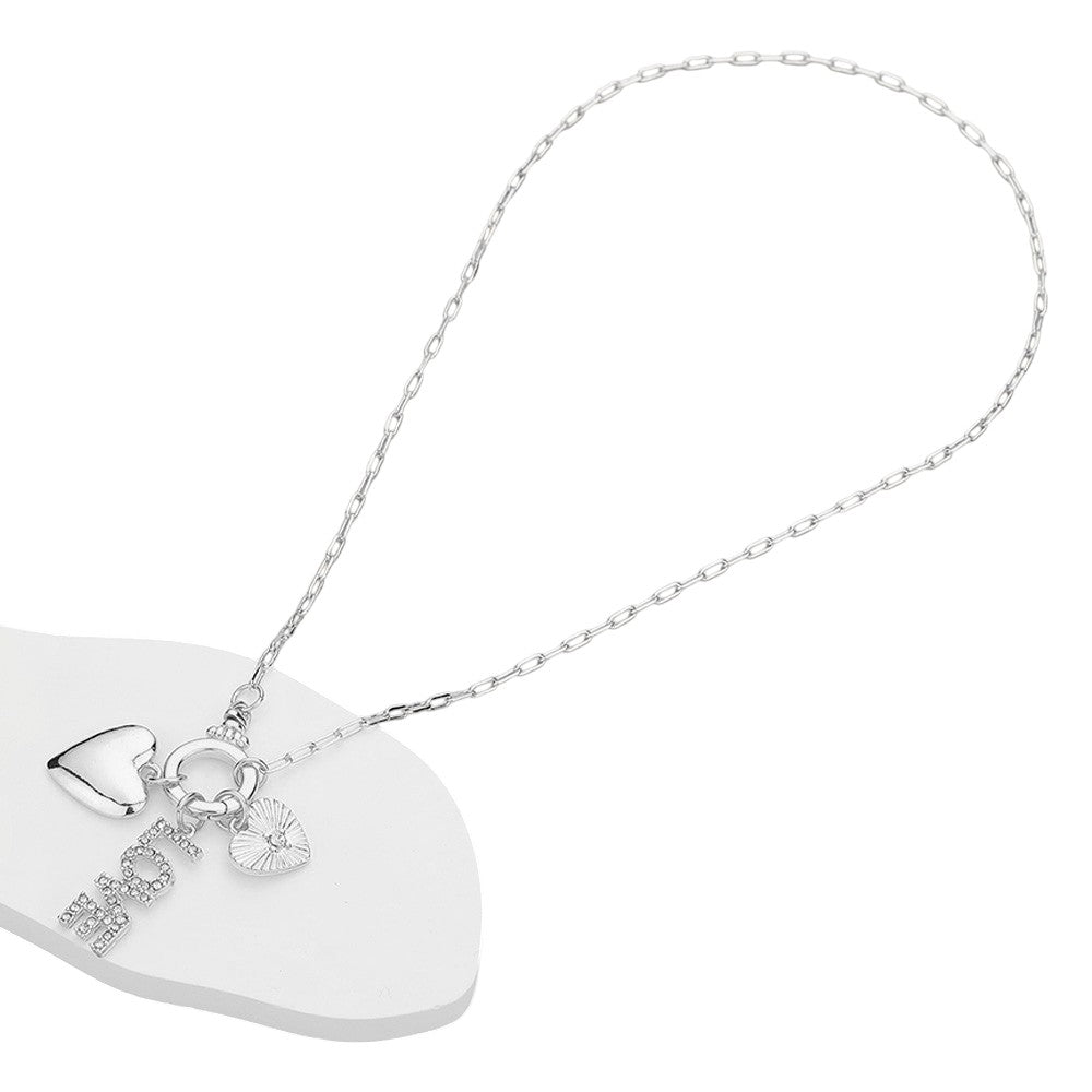 Clear Silver Stone Paved LOVE Message Metal Heart Charms Pendant Paperclip Chain Necklace is the perfect addition to any jewelry collection. With delicate stone paving and a unique paperclip chain design, it exudes elegance and sophistication. Show your love and elevate any outfit with this stunning necklace.