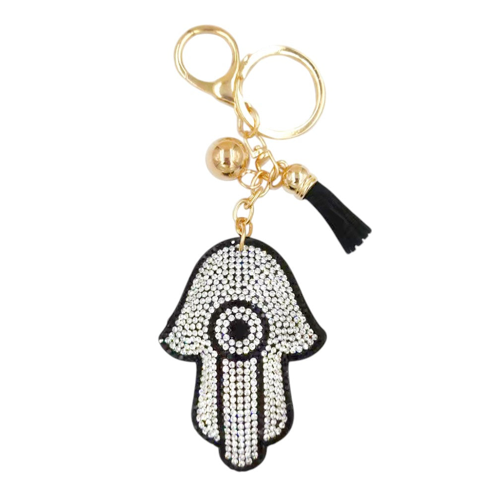 Clear Bling Evil Eye Tassel Bag Charm adds a touch of glamour to any bag. The shiny, evil eye design is sure to catch everyone's attention. The tassel detail offers a playful touch, making this charm a unique accessory. Perfect for adding a little sparkle and charm to your bag. 