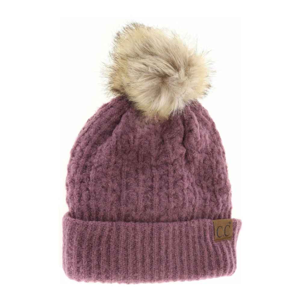 Coco Berry Solid Smocked Stitch Fur Pom C.C Beanie combines expert craftsmanship with functional winter style. Featuring a tightly smocked stitch pattern, this beanie ensures durability and a comfortable fit. The luxurious fur pom adds a refined accent, elevating this essential cold-weather accessory. Its design provides warmth without bulk, making it an excellent choice for outdoor activities or everyday wear during chilly seasons. 