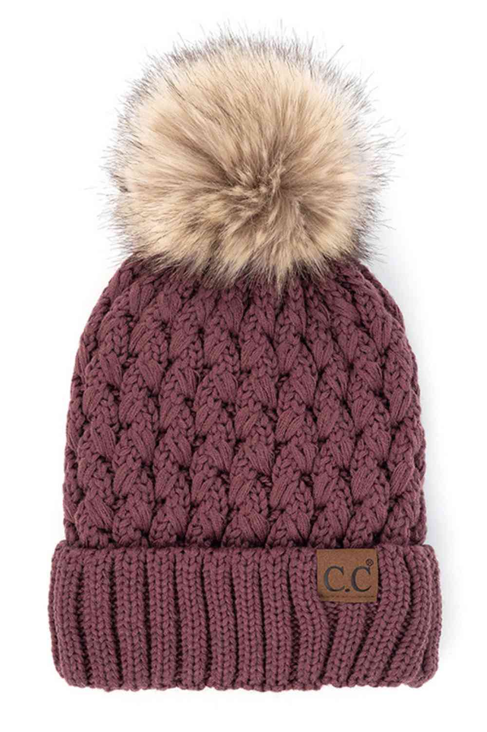 Coco Berry Elevate your winter wardrobe with the C.C Lattice Crossover Stitch Beanie, featuring an intricate lattice pattern and cozy pom detail. Crafted from 100% soft acrylic, this beanie delivers warmth and comfort without the weight. The crossover stitch design adds visual interest while the relaxed fit suits most face shapes. Perfect for layering over your favorite winter looks, this versatile beanie transitions effortlessly from casual outings to outdoor adventures. One size fits most for easy, everyd