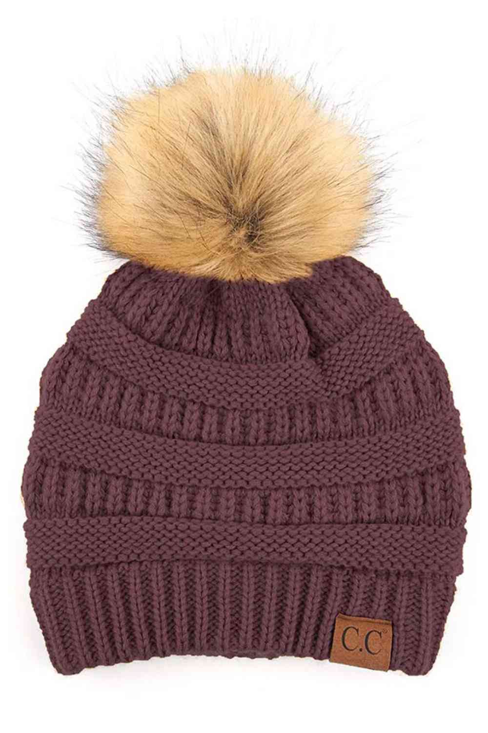 Cocoberry Stay warm and cozy with this classic C.C Pom Pom Knit Beanie, crafted from 100% soft acrylic for all-day comfort. The ribbed knit design adds texture and durability, while the signature pom pom on top brings a playful touch to any winter outfit. One size fits most, making it the perfect accessory for everyone. Ideal for cold weather adventures or casual everyday wear.