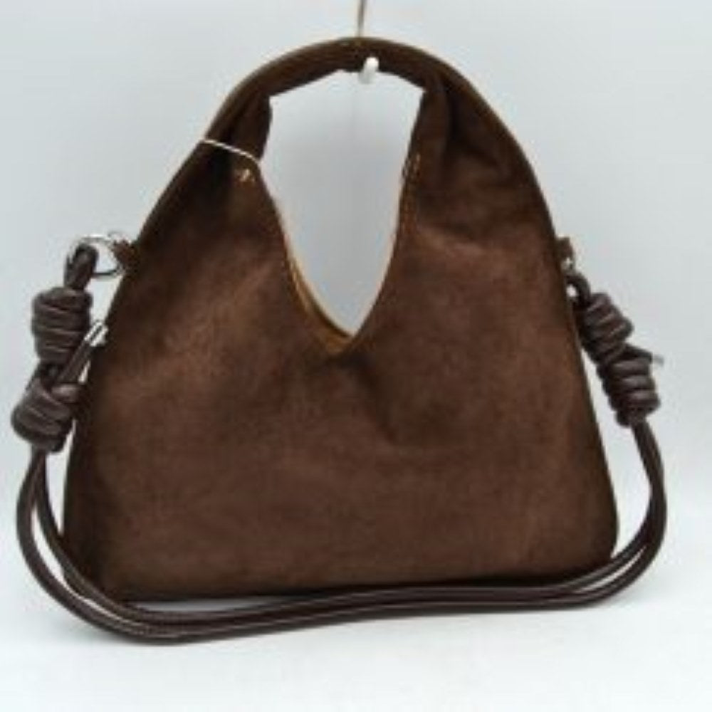 Coffee This slouchy hobo bag features a soft, matte suede-textured exterior with a modern silhouette, making it a stylish choice for everyday use. It is designed with a deep V-shaped cutout that transitions seamlessly into a comfortable, integrated top handle for an easy handheld carry. The look is elevated by a slender, matching shoulder strap attached to silver-tone side rings