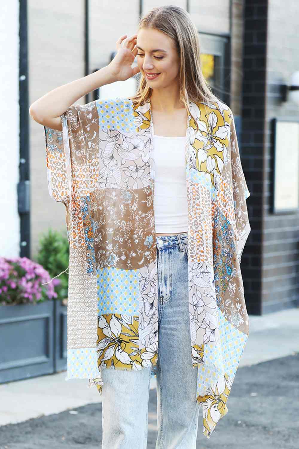 Coffee Effortless summer style meets comfort in this floral mixed pattern kimono cover up. Crafted from 100% viscose, the lightweight fabric drapes beautifully while keeping you cool and comfortable. The versatile one-size fit works for various body types, making it perfect for beach days, poolside lounging, or casual outings. Layer it over your favorite swimsuit or dress for an instantly polished look. Ideal for warm weather adventures.