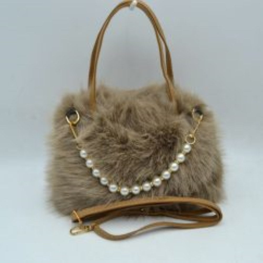 Coffee This unique everyday handbag showcases a soft, textured plush exterior that introduces a cozy aesthetic to your accessory collection. The bag features an expansive central storage compartment to accommodate your daily essentials, styled with double top handles for traditional hand carrying. A distinctive strand of large pearl-like beads draped across the front adds a elegant decorative accent