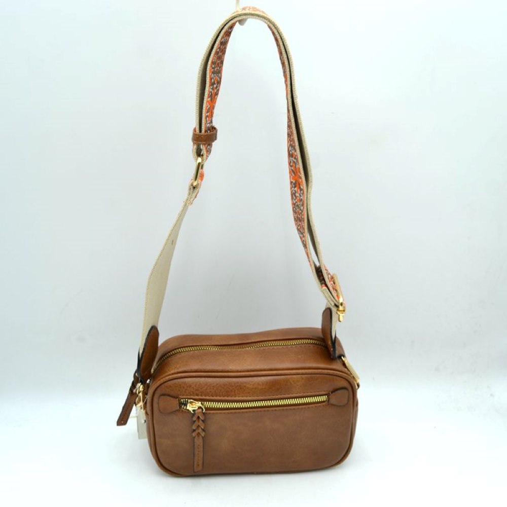 Coffee Meet your new daily go-to accessory. The Patterned Strap Camera Bag seamlessly blends classic, structured utility with a vibrant bohemian edge. Lightweight yet spacious, this crossbody bag is designed to keep your hands free and your essentials beautifully organized whether you are traveling, commuting, or heading out for the weekend.