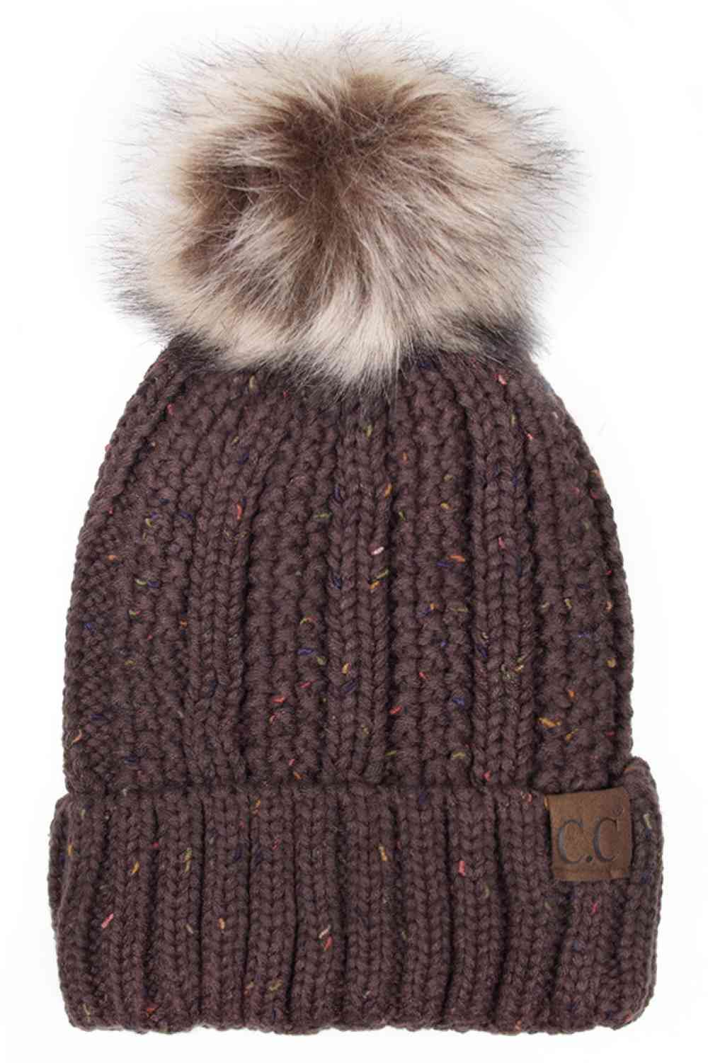 Brown The C.C Fuzzy Fleece Lining Knit Beanie with Pom combines a soft knit exterior with a cozy fleece lining for extra warmth and comfort on chilly days. Finished with a fluffy pom-pom on top, it adds a cute and stylish touch to your winter wardrobe.