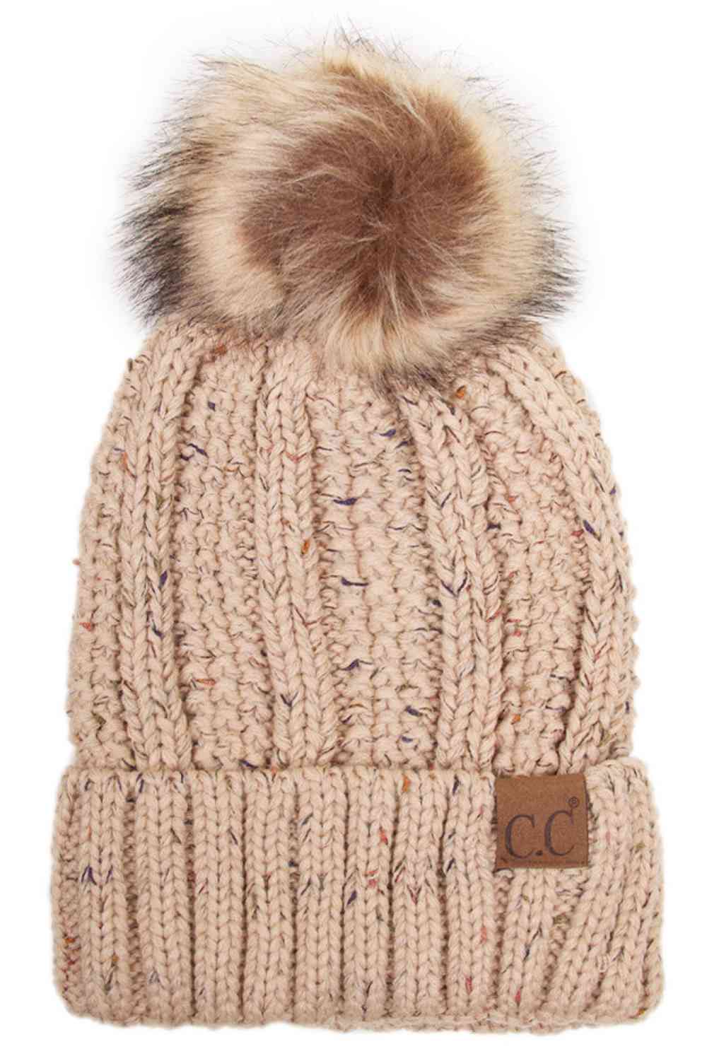 Latte The C.C Fuzzy Fleece Lining Knit Beanie with Pom combines a soft knit exterior with a cozy fleece lining for extra warmth and comfort on chilly days. Finished with a fluffy pom-pom on top, it adds a cute and stylish touch to your winter wardrobe.