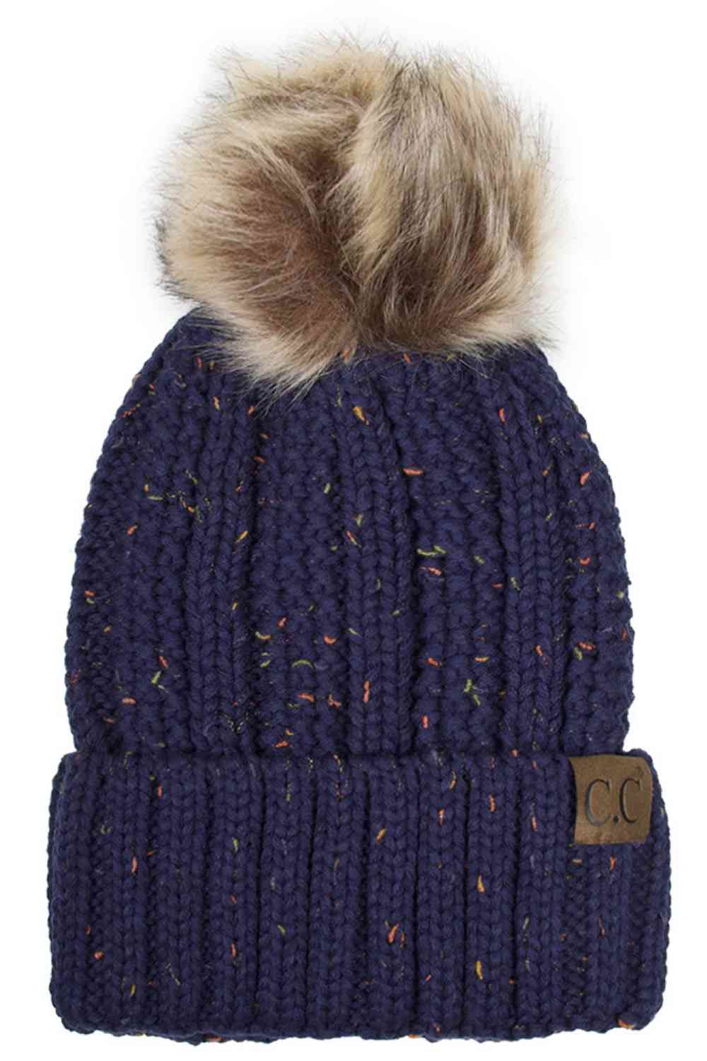 NavyThe C.C Fuzzy Fleece Lining Knit Beanie with Pom combines a soft knit exterior with a cozy fleece lining for extra warmth and comfort on chilly days. Finished with a fluffy pom-pom on top, it adds a cute and stylish touch to your winter wardrobe.