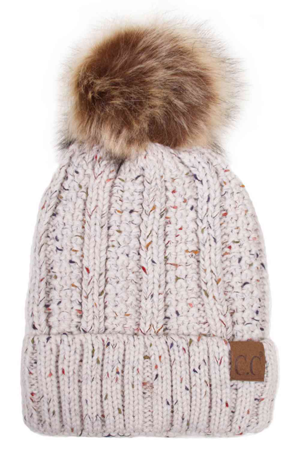 Oatmeal The C.C Fuzzy Fleece Lining Knit Beanie with Pom combines a soft knit exterior with a cozy fleece lining for extra warmth and comfort on chilly days. Finished with a fluffy pom-pom on top, it adds a cute and stylish touch to your winter wardrobe.