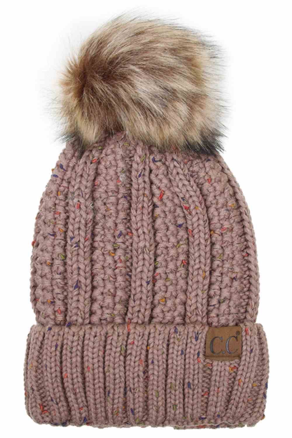 Taupe The C.C Fuzzy Fleece Lining Knit Beanie with Pom combines a soft knit exterior with a cozy fleece lining for extra warmth and comfort on chilly days. Finished with a fluffy pom-pom on top, it adds a cute and stylish touch to your winter wardrobe.