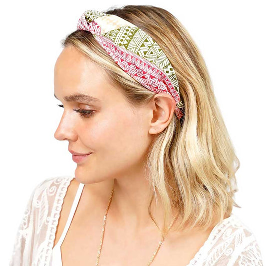 Coral Aztec Patterned Burnout Knot Headband is expertly crafted and features a unique design. Its trendy Aztec pattern and comfortable knot design are perfect for adding a touch of style to any outfit. Made with high-quality materials, it provides both functionality and fashion.