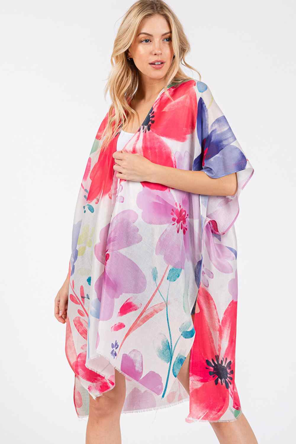 Coral Embrace effortless summer style with this stunning water color floral kimono cover-up. Featuring a vibrant, artistic floral print in soft watercolor hues, it's the perfect lightweight layer for beach days, poolside lounging, or casual outings. Crafted from 100% polyester, this kimono offers breathable comfort and easy care. The generous 35" x 36" dimensions provide relaxed, flowing coverage that flatters all body types. Slip it on over your swimsuit or favorite summer dress for an instantly polished l