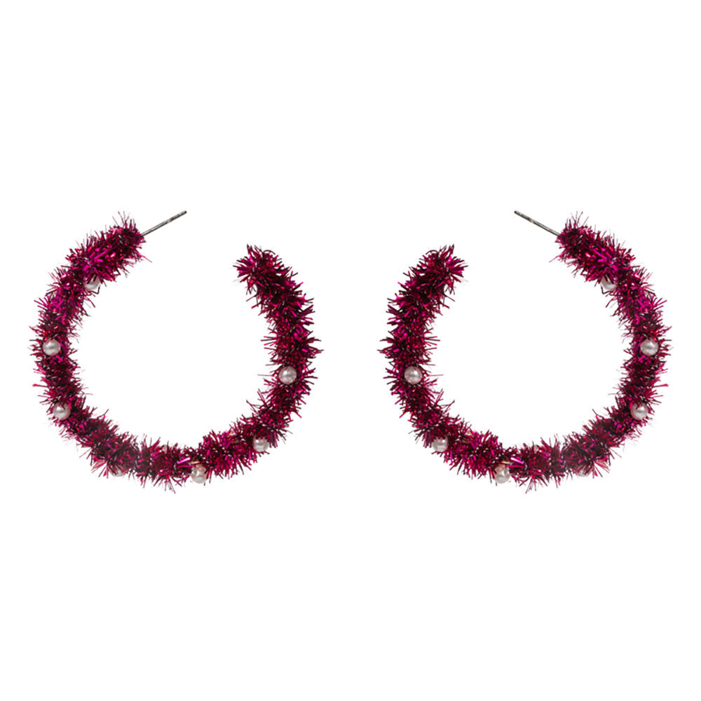 Celebrate the season with these festive tinsel hoop earrings, decorated with miniature ornament accents for a cheerful holiday touch. Lightweight and eye-catching, they’re perfect for adding playful flair to party outfits, winter gatherings, or seasonal celebrations.