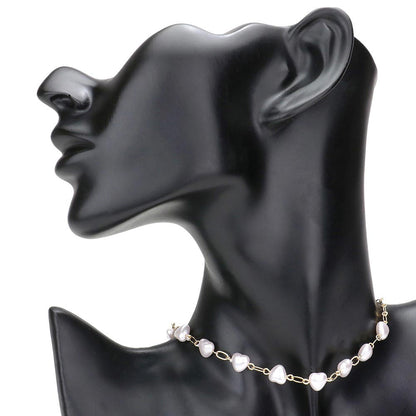 Cream Heart Pearl Link Choker Necklace, is crafted with the utmost attention to detail and quality. It features a unique link design and a stunning heart-shaped pearl, perfect for special occasions or gifting. Its classic design makes it a timeless addition to any collection.