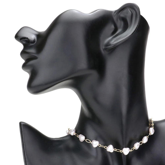 Cream Heart Pearl Link Choker Necklace, is crafted with the utmost attention to detail and quality. It features a unique link design and a stunning heart-shaped pearl, perfect for special occasions or gifting. Its classic design makes it a timeless addition to any collection.