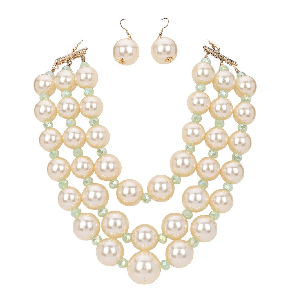 Cream Triple Layered Chunky Pearl Necklace is a gorgeous addition to any outfit. Made with high-quality pearls in a unique triple layer design, this necklace adds a touch of elegance and sophistication to your look. Its chunky style makes a statement while still remaining versatile for any occasion. Upgrade your jewelry collection with this must-have piece. 