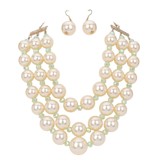 Cream Triple Layered Chunky Pearl Necklace is a gorgeous addition to any outfit. Made with high-quality pearls in a unique triple layer design, this necklace adds a touch of elegance and sophistication to your look. Its chunky style makes a statement while still remaining versatile for any occasion. Upgrade your jewelry collection with this must-have piece. 