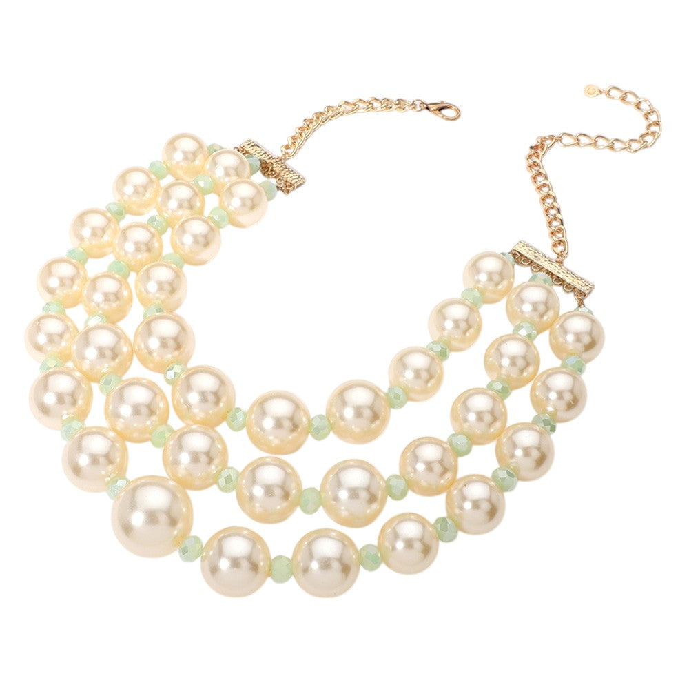 Triple Layered Chunky Pearl Necklace is a gorgeous addition to any outfit. Made with high-quality pearls in a unique triple layer design, this necklace adds a touch of elegance and sophistication to your look. Its chunky style makes a statement while still remaining versatile for any occasion. Upgrade your jewelry collection with this must-have piece. 