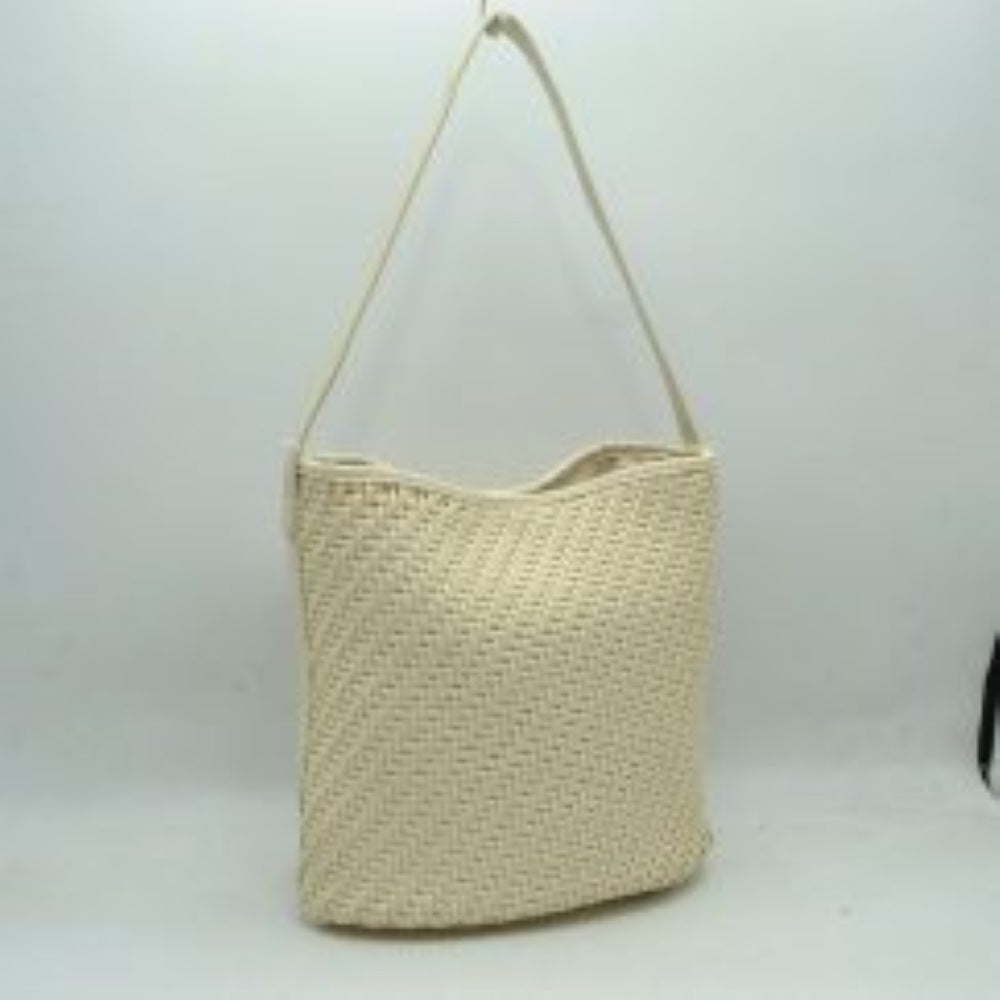 Cream This everyday hobo bag features an all-over classic basket-weave design and a relaxed, structured bucket silhouette. It is crafted with a single wide matching shoulder strap attached securely to the top panels, allowing for comfortable hand or shoulder carrying. The spacious main storage compartment features a slight dip-top opening, making it an ideal choice for organized daily use.