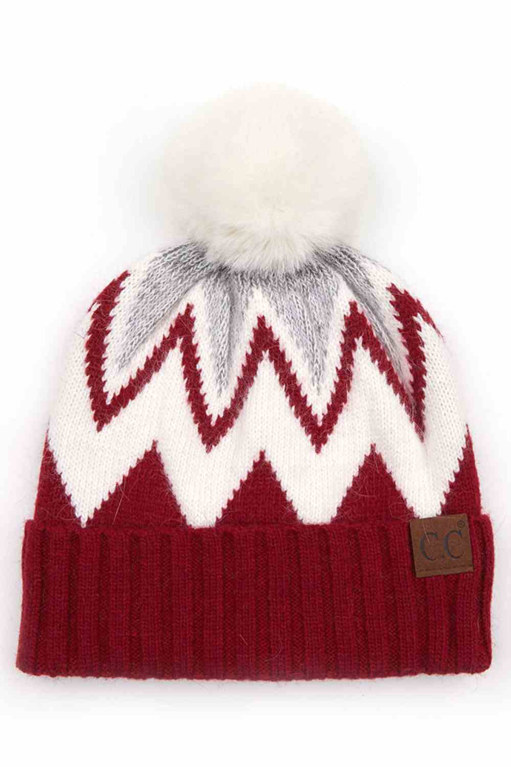Crimson Stay warm and stylish with this chevron knit beanie crafted from a premium blend of 70% acrylic and 30% angora. The ribbed construction provides a snug fit, while the fluffy pom pom adds a playful touch. Soft, breathable, and designed to complement any winter look, this versatile beanie is your go-to accessory for cold weather comfort.