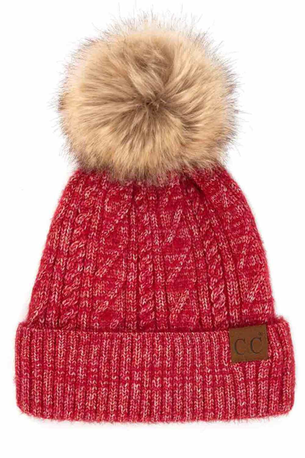 Crimson The C.C Soft Cuff Beanie in Mixed Cable Pattern with Faux Fur Pom features a stylish blend of cable-knit textures topped with a plush faux fur pom for a chic winter look. Made from soft, stretchy fabric with a cozy cuff, it provides warmth, comfort, and a snug fit for cold-weather wear.