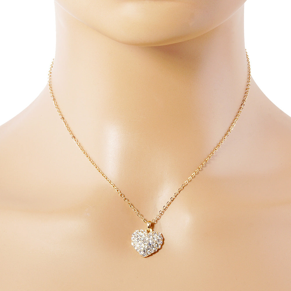 Crystal Pave Heart Pendant Necklace is crafted to bring a touch of sophistication to any outfit. Its sparkling pave crystals are timeless and elegant, while the heart-shaped pendant symbolizes love and affection. Made from high-quality materials, this necklace is designed to make a statement and elevate your style effortlessly. 